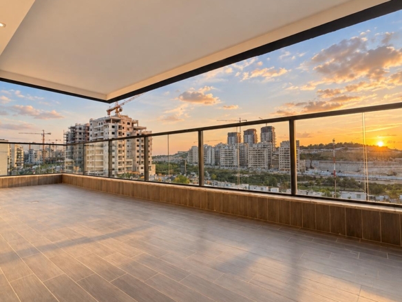 Frankel apartment balcony overlooking Neve Shamir at sunset.