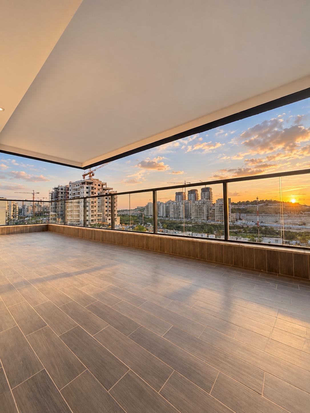1002777833 Frankel apartment balcony overlooking Neve Shamir at sunset.