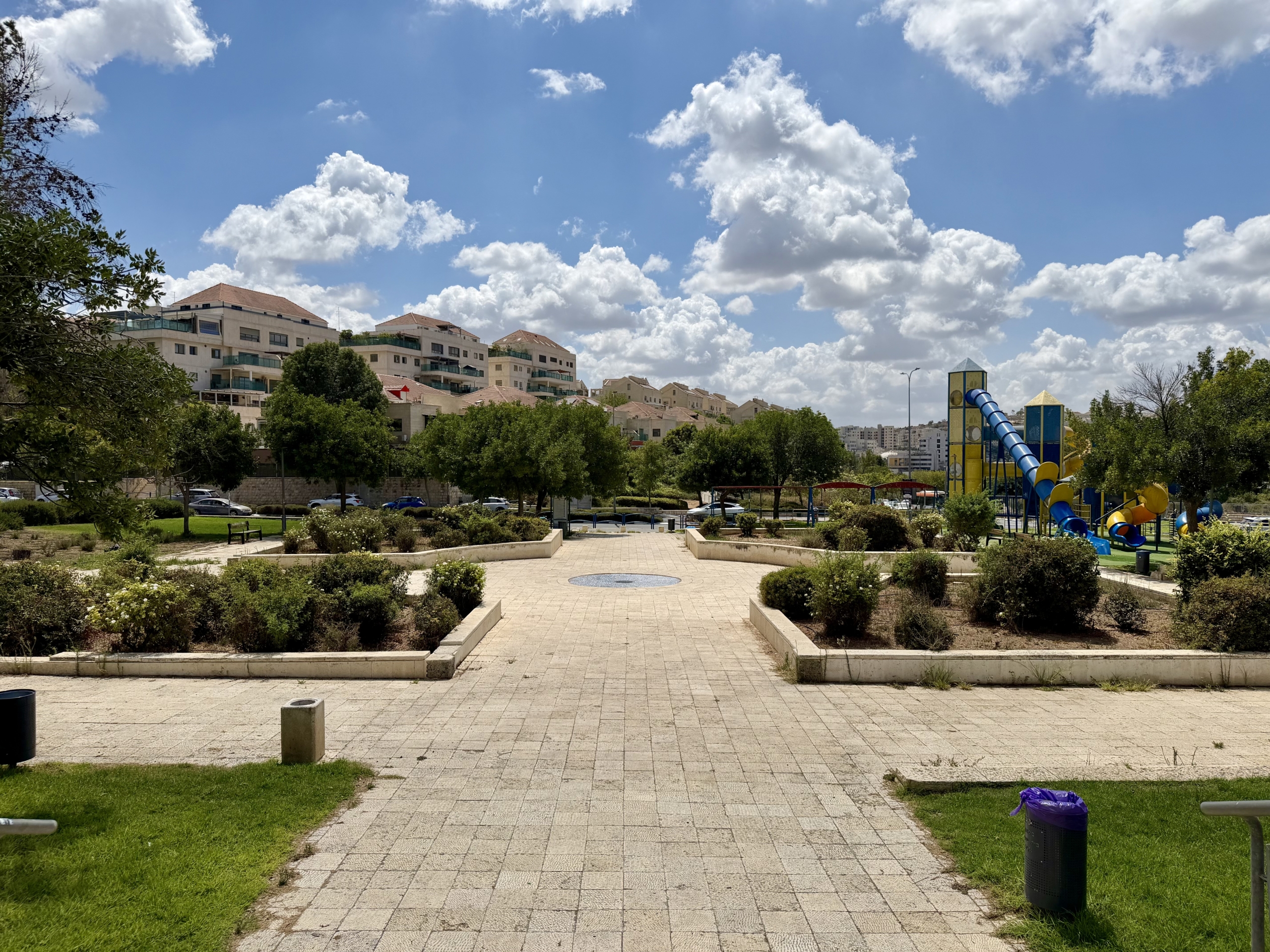 Paths, planted gardens, and a playground in Ayalon Park.